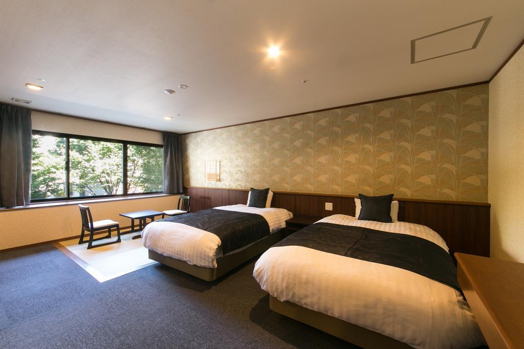Suimeikan Gero Kültér fotó A room at the hotel